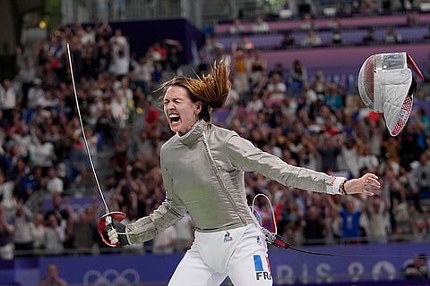 Manon Apithy Brunet celebrates after winning  women's individual Sabre quarterfinal